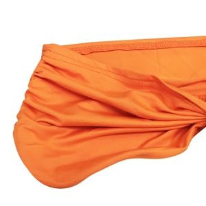 Detail of bright orange high-elastic fabric with stitching and pleat textures