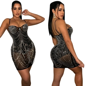 Detail view of sparkly rhinestones on sexy black mesh bodycon party mini dress