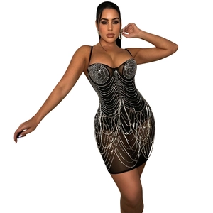 Detail of black bodycon dress with silver rhinestone chain fringe and thin straps