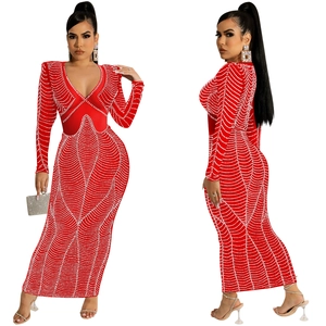 Detail of red V-neck maxi dress with white pearl wave patterns and shoulder pads