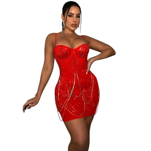 Close-up of red sequined bodycon dress with silver chain fringe details and molded cups