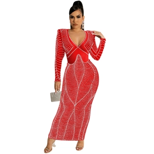 Detail of red mesh bodycon dress with rhinestone patterns and deep V-neckline