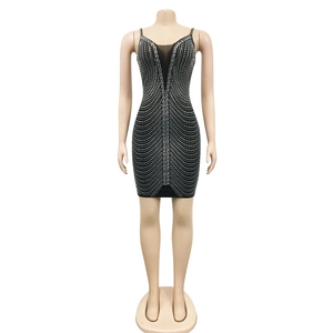 Detail of black mini dress with deep V-neck mesh insert and sparkling silver rhinestones