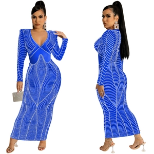 Detail of navy blue V-neck maxi dress featuring rhinestones and mesh patchwork textures