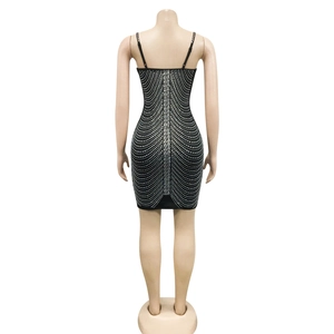 Close-up back view of a black bodycon dress featuring shimmering silver rhinestones