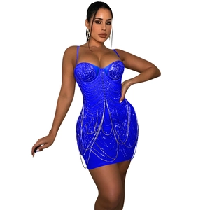 Detail of royal blue bodycon dress featuring layered rhinestone chain tassels and heart neckline