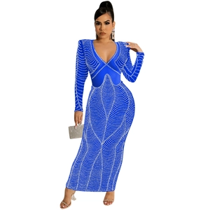 Close-up of sparkling rhinestones and mesh texture on this sexy navy blue V-neck maxi dress
