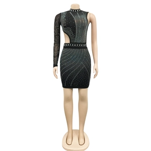 Detail of black rhinestone mini dress with mesh sleeve and waist cutout on mannequin