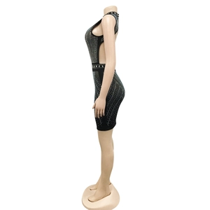 Detail view of the silver rhinestones and sexy side hollow-out on the black mesh dress