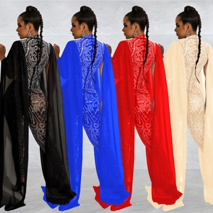 Detail of rhinestone jumpsuit featuring elegant cape sleeves and sheer mesh patterns