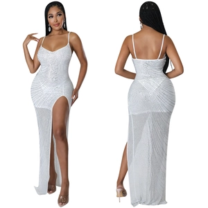 Detail view of white sequined evening dress with high slit and plunging V-neckline