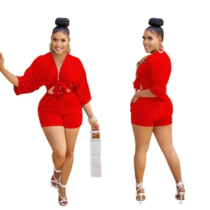 Front and side view of a red two-piece fashion set with V-neck tie top and high waist shorts