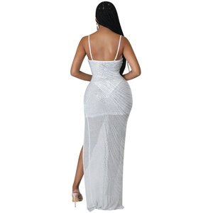 Detailed back view of a sheer white mesh dress featuring shimmering rhinestones and a side slit