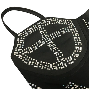Detailed view of black rhinestones corset with geometric pattern and crystal embellishments