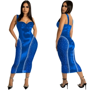 Close-up of royal blue bodycon midi dress with sparkling white rhinestone side accents