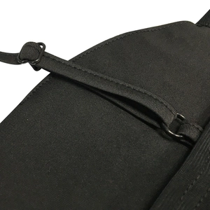 Close-up of adjustable straps and hardware on a black rhinestone party midi dress