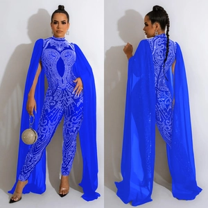 Blue rhinestone jumpsuit set with cutout details and floor-length sheer mesh cape