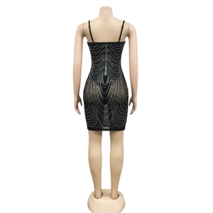 Close-up detail of silver rhinestone chains on a black sheer party dress for women