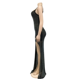 Detail view of shimmering silver rhinestones on a sexy black high slit mesh evening dress