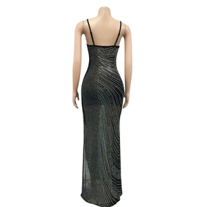 Detailed back view of a sheer black mesh gown with radiant silver rhinestone patterns