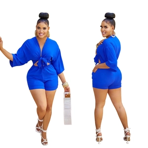 Royal blue two-piece set featuring a tie-front crop top and matching high-waist tight shorts
