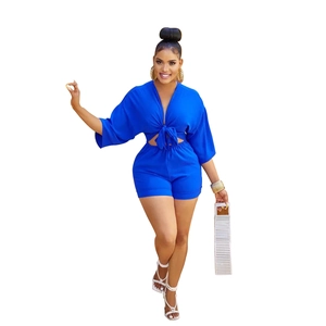 Deep V-neck tie-front crop top with matching high waist shorts in bright blue