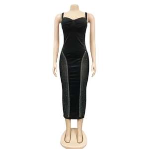Detail of sheer mesh side panels with sparkling rhinestones on a black bodycon dress