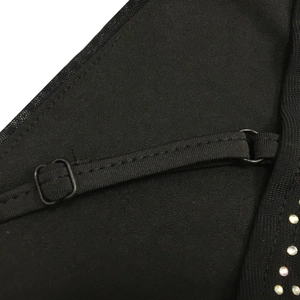 Detail of adjustable black strap with silver rhinestones and sheer mesh on sexy dress