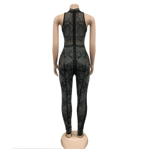 Rear view detail of black mesh jumpsuit with vertical silver rhinestones and back zipper
