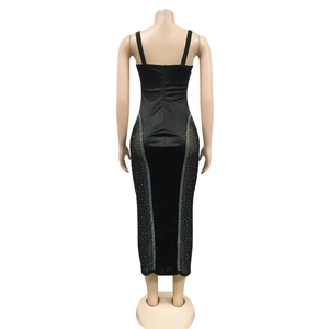 Back view of bodycon midi dress featuring sheer mesh panels and sparkling rhinestones