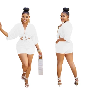 Front and side view of white V-neck short sleeve crop top and high waist shorts set
