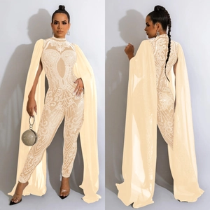 Detail of rhinestone mesh jumpsuit showing the front and back view with long cape sleeves