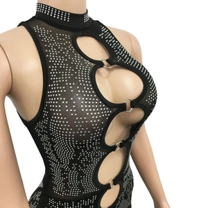 Detail view of sheer mesh fabric with sparkling silver rhinestones and metal ring connectors