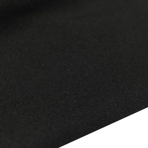 Detailed close-up showing the texture of black rhinestone sheer fabric for evening dresses