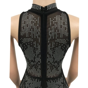 Detail of back hidden zipper and rhinestones on black mesh sleeveless jumpsuit