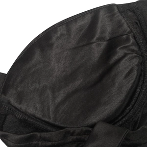 Close-up of black mesh fabric texture and high-quality stitching on the dress detail