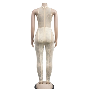 Detail view of mesh jumpsuit featuring sparkling rhinestones and a hidden back zipper