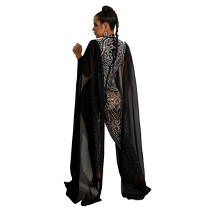 Detail of black rhinestone bodysuit featuring back cut-out and sheer chiffon cape