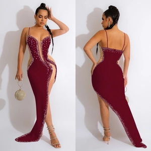 Detail view of burgundy V-neck evening dress with rhinestone accents and mesh cutouts
