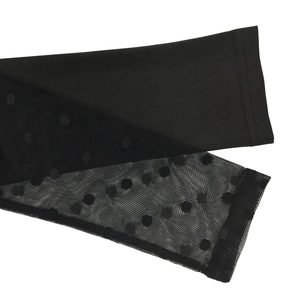 Detail of black polka dot mesh sleeve stitching and fine double needle sewing work