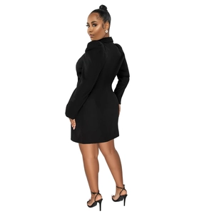 Detail of elegant black blazer dress featuring stylish puff sleeves and slim fit design