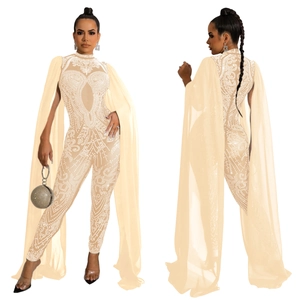 Detail of rhinestone jumpsuit with sheer mesh cape sleeves and intricate beadwork