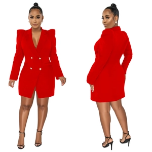 Detail of red double-breasted blazer dress featuring structured shoulders and gold buttons