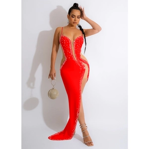 Detailed close-up of red sequin evening dress with deep V-neck and high side slit