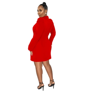 Detail of red blazer dress featuring elegant lapel collar and structured puff sleeves