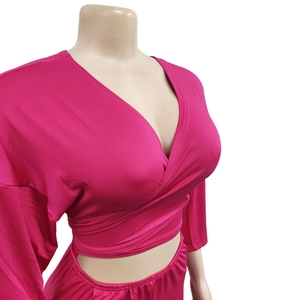 Hot pink wrap top and elastic waist shorts set on a mannequin with high quality stitching