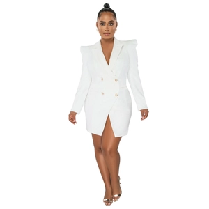Detail of white double-breasted blazer dress with gold buttons and padded shoulders