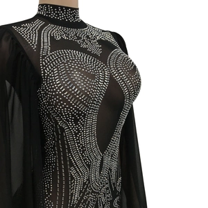 Detail of silver rhinestones on sheer black mesh of this elegant evening jumpsuit