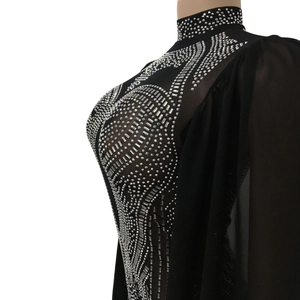 Close-up detail of silver rhinestones and sheer mesh on black fashion jumpsuit