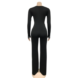 Detail view of rhinestone embellishments on the sleeves of a black slim-fit jumpsuit